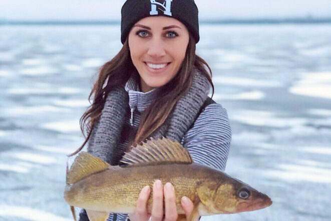 Woman holding Walleye - Ice fishing