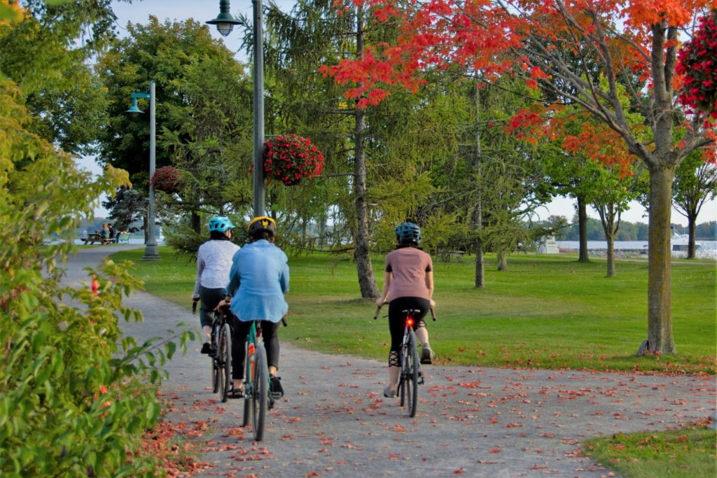 Three cyclists are shown on Zwick's Park trail.
